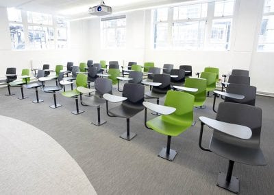 Designer lecture or conference chairs in charcoal grey and lime green options with integrated writing or laptop table
