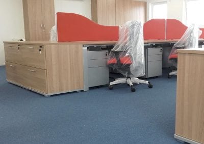 Bespoke workstation desking with wave divider screens, pedestal drawer units, desk end drawer storage units and fully adjustable operator chairs