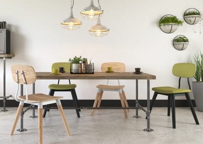 Designer breakout or dining chairs in wood and metal and fabric and metal options around a funky steampunk table with solid wood top and legs made from plumbing tubing and fittings