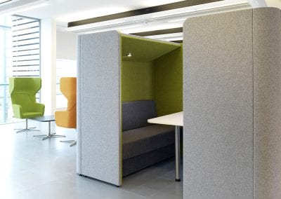 Rectangular meeting or dining pod with overhead canopy, lighting and integrated table