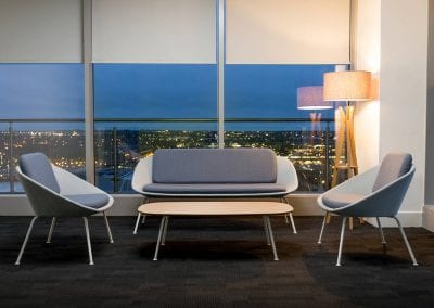 Two tone grey occasional chairs and sofa with grey metal legs and matching coffee table with wooden top