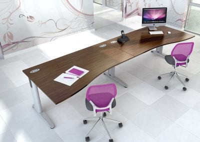 Wave form beam reception desks with wood veneer tops, metal legs and cable management