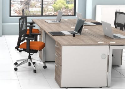 Dark wood effect desks with metal legs, integrated 3 drawer pedestal units and mesh back operator chairs
