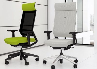 Fully adjustable designer executive chairs with arms and high backs and shown in full padded fabric and mesh backed options