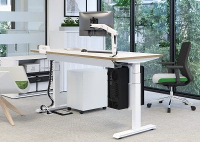Electric white sit or stand height adjustable desk with matching pedestal drawer unit and Tambour door storage units and fully adjustable operators chair