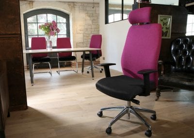 Dark pink, black and chrome base executive chairs with swivel and fixed bases, and meeting table