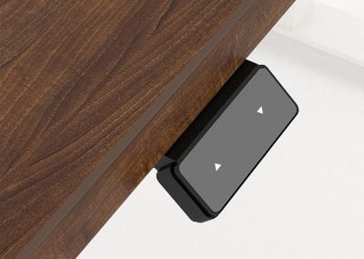 Close up detail of electric buttons on a height adjustable desk