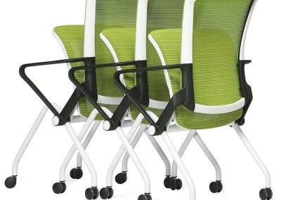 Three space saving meeting chairs with lift up seats allowing them to interleave with each other. Chairs have white frames, black arm rests and lime green fabric seat pads and mesh backs