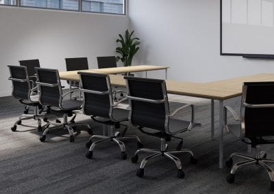 Designer black leather and chrome boardroom chairs with swivel bases, wood effect meeting tables and large wall mounted whiteboard