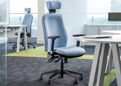 Fully adjustable high back executive chair with arm rests and headrest with white designer desk and storage cabinets