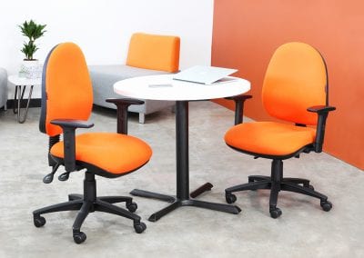Fully adjustable operator task chairs with arms, circular meeting table, occasional modular seating and small coffee table