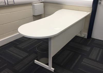 White bespoke desk with metal frame, modesty panel and cable ports