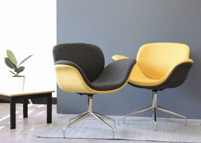 Yellow and black designer occasional chairs with chrome legs and coffee table