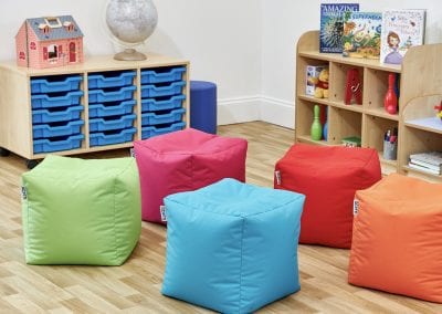 Early Years Nursery furniture including mobile tray storage cabinet, display shelves and cube bean bags