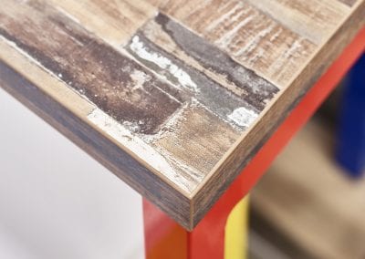 Close up of bench table top showing the aged rustic wood look finish