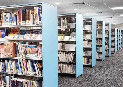 Modular library book display shelving with height adjustable shelves, either fixed position or mobile units on castors