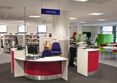 Library information and help point furniture with operator chairs and book display cases