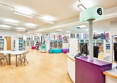 Fully fitted library with information desks, occasional seating, fixed and mobile book shelves, display cases, tables and seating