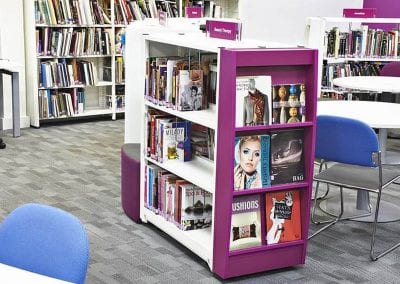 Educational library mobile book display unit with coloured end shelving section