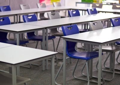 Modular and durable educational classroom tables with metal legs and molded stacking chairs