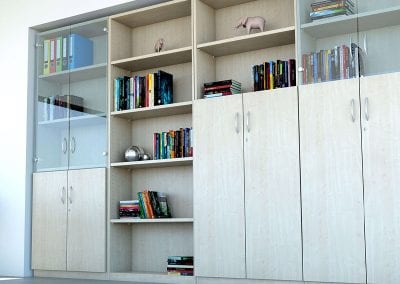 Tall wood veneer storage units including glass door display units, shelving units and combination cupboard and shelving units