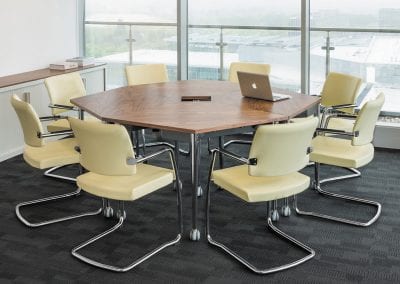 Walnut veneer meeting tables with chrome legs and cream leather meeting chairs with chrome legs