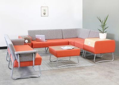 Staff room modular sofa seating with matching coffee table and side tables with charging ports
