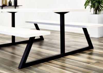 All in one picnic style bench table and seating with white tops and black metal frame
