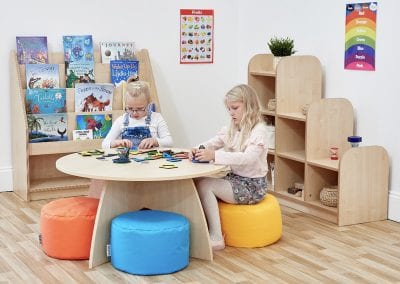 Early Years Nursery furniture including book display unit, display shelves, table and soft seating stools