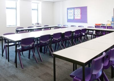 White top tables in square and rectangular options with purple moulded plastic stacking chairs