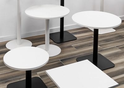 Circular and square coffee tables with white and black legs