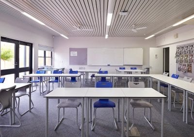 Modular and durable educational classroom tables with metal legs and molded stacking chairs