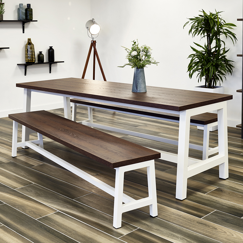 Tick Solutions Bench Tables Fade In Photograph of three Rockit stools set at different heights, one red, one black and one white