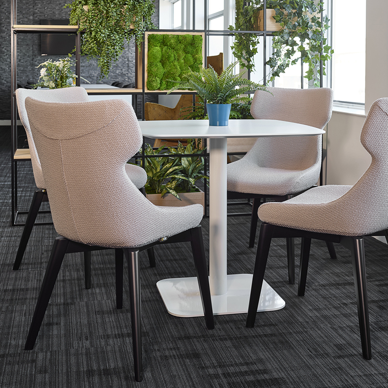 Tick Solutions Staff Room Fade In Photograph of three Rockit stools set at different heights, one red, one black and one white
