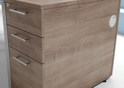Side profile of a wood veneer 3 drawer pedestal unit with pass though cable managment ports