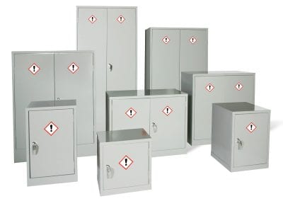 A selection of different sized hazardous materials storage cabinets in grey finish, all with locking handles