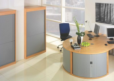 Wooden office storage units with grey tambour doors to compliment desk solutions in the same finish