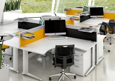 Designer coloured multi-purpose desktop screen fitted to white desks with silver legs and matching white pedestal units