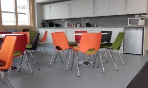 Colour coded breakout chairs with padded seat and chrome legs