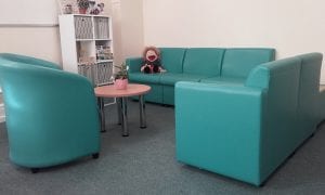 Turquoise leather soft seating sofas and tub chair with chrome legged occasional table