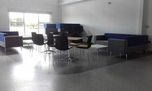 Modular sofas and meeting cube with brushed metal legs and refectory style table and seating
