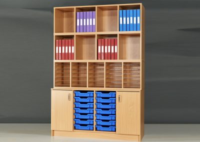 Wooden storage unit with multi tier shelving, coloured plastic trays and storage cupboards