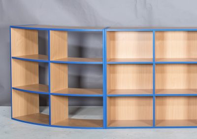 Straight and curved colour coded wooden shelving units with height adjustable shelves
